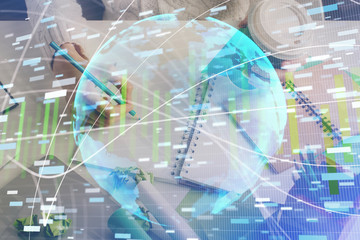 International business hud over woman's hands writing background. Concept of hard work. Double exposure