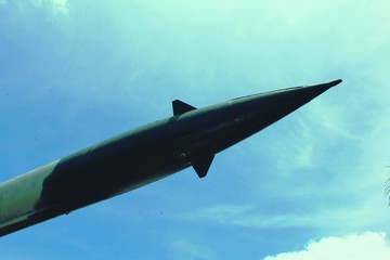 Old military missile against the blue sky. Air Defense.