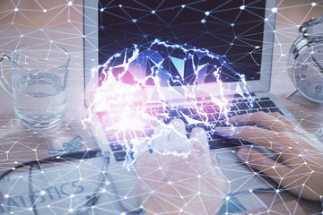 Man typing on keyboard background with brain hologram. Concept of big Data.