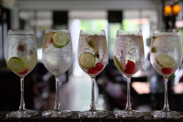 summer drinks of gin tonic alcoholic cocktails on table