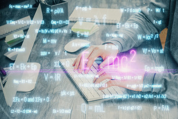 Science formula hologram with man working on computer on background. Education concept. Double...