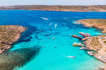Panorama of Blue Lagoon Comino Malta. Cote Azur, turquoise clear water with white sand. Aerial view