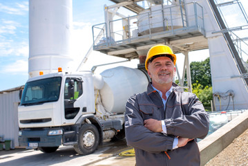 Civil engineer wearing safety helmet at ready mix concrete plant