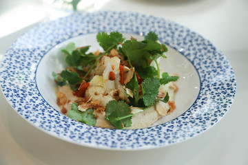 Hummus appetizer with cauliflower and herbs
