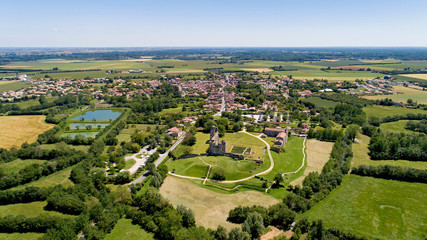 Aerial view of Maillezais abbey in the Poitevin marsh, France - obrazy, fototapety, plakaty