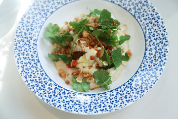 Hummus appetizer with cauliflower and herbs