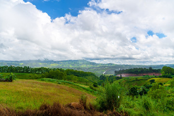 Naklejka premium Blue sky high peak mountains fog hills mist scenery national park views at Phu Tub Berk, Khao Koh, Phetchabun Province, Thailand