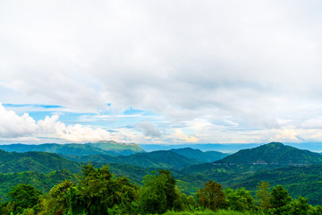 Blue sky high peak mountains fog hills mist scenery national park views at Phu Tub Berk, Khao Koh, Phetchabun Province, Thailand