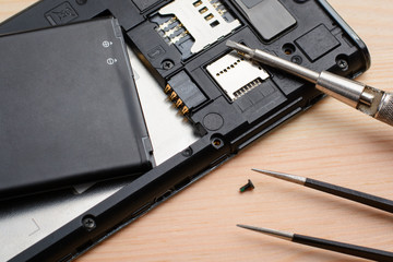 Repairing mobile phone in electronic smart technology service