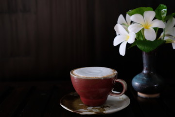 Cappuccino coffee cup on wood table