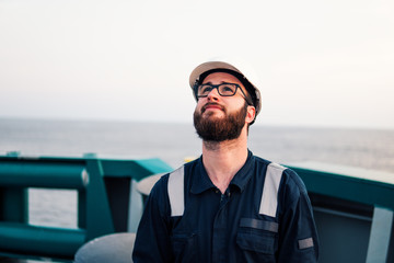 Deck Officer on deck of offshore vessel or ship , wearing PPE personal protective equipment
