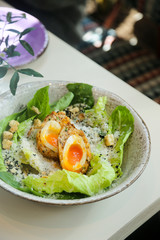 Caesar salad with Scottish egg