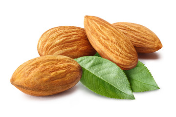 Plakat Close-up of almonds with leaves, isolated on white background