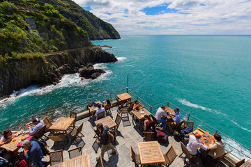 Outdoor restaurant with sea view in small village, Cinque Terre, Italy