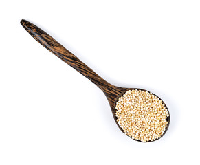 Quinoa seeds in wood spoon isolated on white background