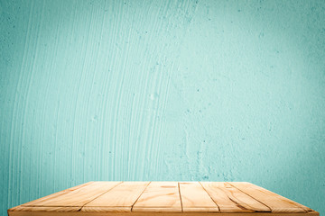 empty wooden on backdrop blue cement surface texture of concrete. Wood table top. can used for display or montage your products