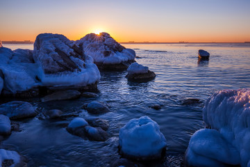 Sunrise by the sea in winter