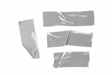 Set of Grey tapes on white background. Torn horizontal and different size gray sticky tape, adhesive pieces.