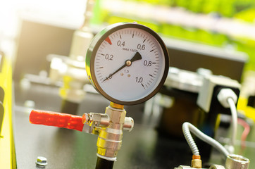 Close up of house heating system with many steel pipes, manometers and metal tubes.