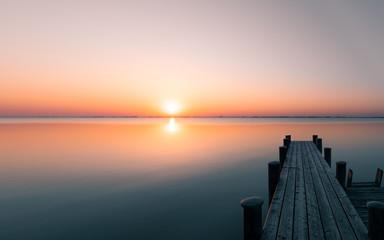 Lake "Neusiedler See" with a wooden bridge, sunrise, Austria