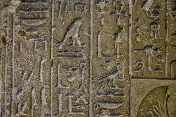 Egyptian ancient hieroglyphs on the stone wall