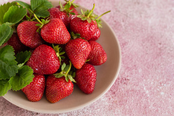 Fresh juicy strawberry on a concrete background. It can be used as a background