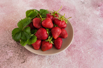 Fresh juicy strawberry on a concrete background. It can be used as a background