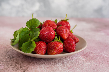 Fresh juicy strawberry on a concrete background. It can be used as a background