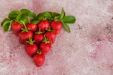 Fresh juicy strawberry on a concrete background. It can be used as a background