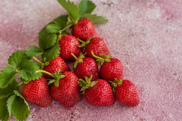 Fresh juicy strawberry on a concrete background. It can be used as a background