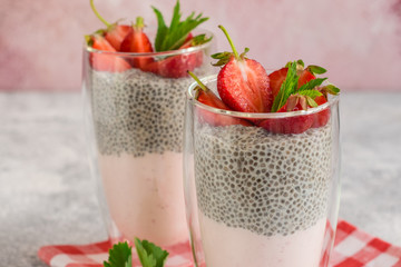 Beautiful and tasty dessert with strawberry and chia seeds. A fresh pudding with fruit for breakfast
