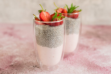Beautiful and tasty dessert with strawberry and chia seeds. A fresh pudding with fruit for breakfast