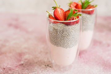Beautiful and tasty dessert with strawberry and chia seeds. A fresh pudding with fruit for breakfast