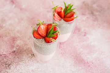 Beautiful and tasty dessert with strawberry and chia seeds. A fresh pudding with fruit for breakfast