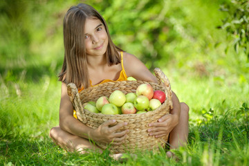 Girl with apples in nature. 