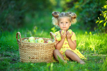 Little girl with fruit. 