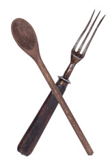 Beautiful old vintage crossed knife and fork isolated on white background. Top view. Retro silverware.