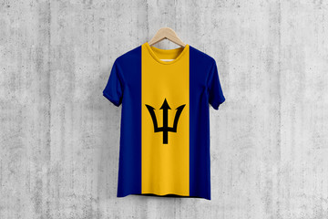 Barbados flag T-shirt on hanger, Barbadian team uniform design idea for garment production. National wear.