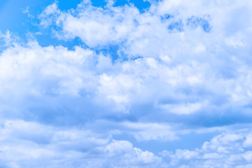 light fluffy clouds on a bright blue sky