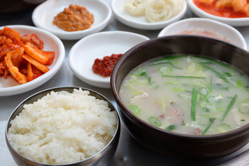 Korean food Dwaeji-gukbap. Rice and pork soup in a steaming stone bowl.