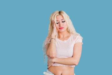 Fototapeta premium Studio shot of good-looking beautiful woman isolated against studio wall