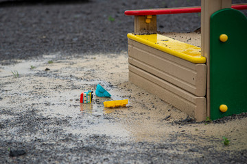 Children's toys thrown in the sandbox