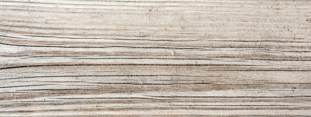 texture of antique floorboards, old dried wood with a lot of cracks and peeling fibers, closeup abstract background