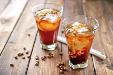 Tasty appetizing refreshing cold coffee with ice in glasses.