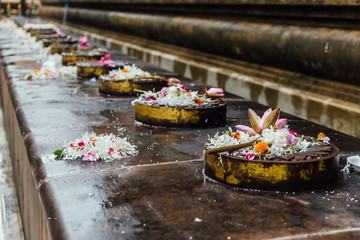 Cankamana (Cloister Walk) where The Lord Buddha walking on these platforms with blooming lotus and flowers in Mahabodhi Temple while raining at Bodh Gaya, Bihar, India