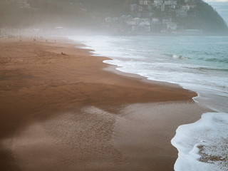 Ondarrete beach in San Sebastian on a foggy day