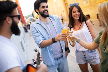 Group of friends hanging out, having fun and enjoying summer days