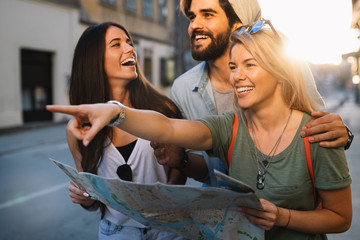 Group of smiling friends traveling. Friendship, travel, vacation, summer and people concept.