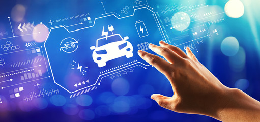 EV with hand pressing a button on a technology screen