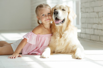child with a dog at home 